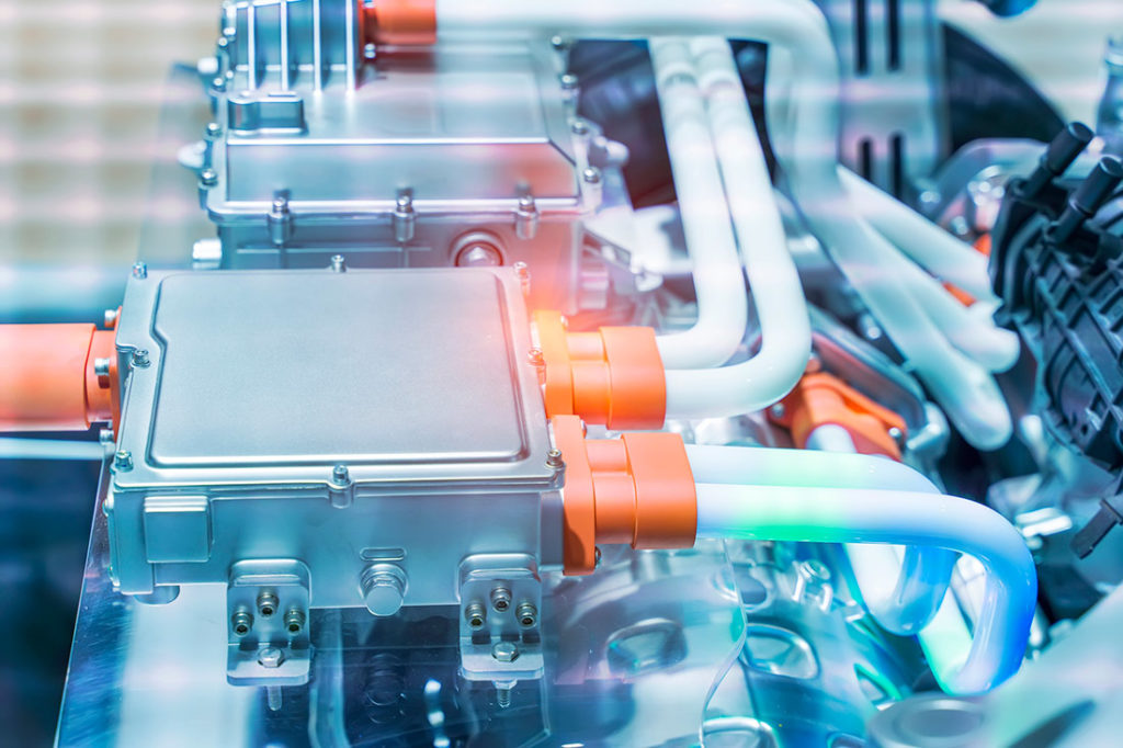 Battery and wire installed on electric system of eco car engine, Automotive part concept.